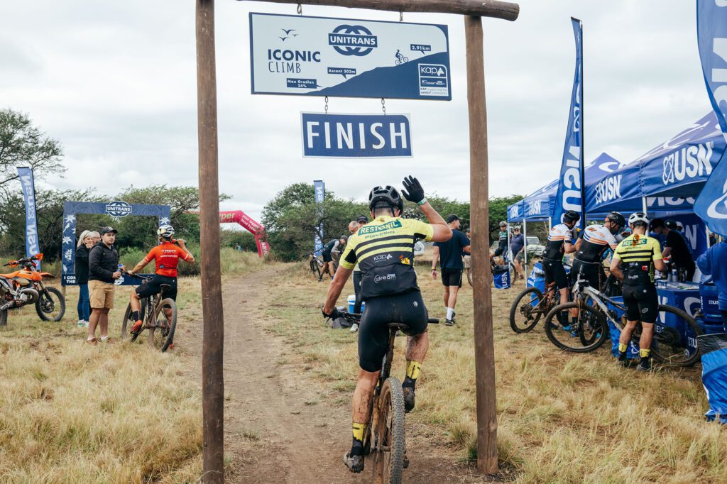 As the KAP sani2c gears up for its 21st edition in May 2025, founder Farmer Glen still marvels at how fast time has flown. “I know, it’s scary, hey? If you’d asked me, I would have said we’ve done maybe 11, not 21,” he muses. For two decades, this iconic three-day mountain bike race has delivered more than just a ride—it’s been a journey of grit, camaraderie, and deep community impact.