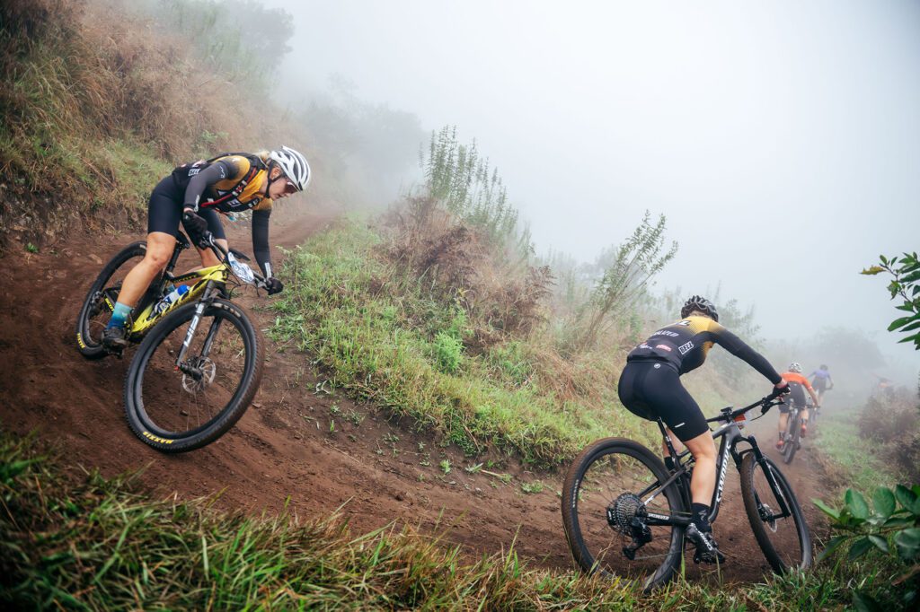 Sani2C, Covering approximately 270 kilometers from the foothills of the Drakensberg to the Indian Ocean, the sani2c route is legendary. Riders push through misty midlands, indigenous forests, and the infamous Umkomaas Valley descent before the final stretch along the coast. Every section, from the thrilling “Umko Drop” to the punishing “Unitrans Iconic Climb,” tells its own story.